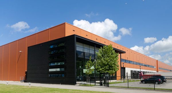 Exterior of a commercial warehouse painted in Black and Orange.